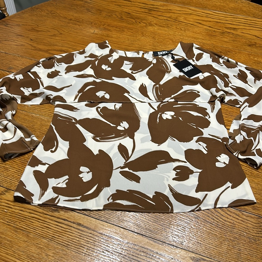 DKNY cold shoulder style blouse. New w/tags. Cream and brown floral. Size Small.